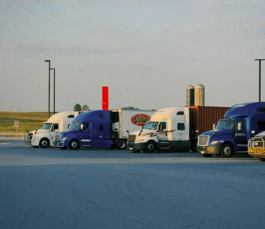Commercial trucking fleet parked at a transportation facility